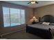 Cozy bedroom with a large window looking out onto the beautiful pool at 10773 W Prickly Pear Trl, Peoria, AZ 85383