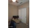 Neutral-toned bedroom with carpet flooring and closet space at 10773 W Prickly Pear Trl, Peoria, AZ 85383