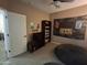 Gaming-themed bedroom with a flat-screen TV and beanbag chair at 10773 W Prickly Pear Trl, Peoria, AZ 85383
