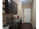 Laundry room complete with washer, dryer, and storage cabinets at 10773 W Prickly Pear Trl, Peoria, AZ 85383