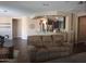 Living room view showcases open floor plan and bar top to kitchen at 10773 W Prickly Pear Trl, Peoria, AZ 85383
