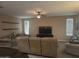 Spacious living room with lots of natural light and stylish ceiling fan at 10773 W Prickly Pear Trl, Peoria, AZ 85383