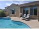 Sparkling pool with lounge chairs and well-maintained deck at 10773 W Prickly Pear Trl, Peoria, AZ 85383