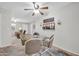 Cozy dining area with seating for four, view into the living room, and stylish decor at 10873 W Clair Dr, Sun City, AZ 85351