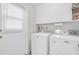 Clean laundry room features a new washer and dryer at 10873 W Clair Dr, Sun City, AZ 85351