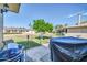 Cozy patio area perfect for outdoor grilling and entertaining, with views of backyard at 10873 W Clair Dr, Sun City, AZ 85351