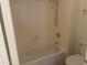 Bathroom with bathtub and tiled walls at 11109 W Amelia Ave, Avondale, AZ 85392