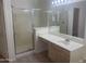 Bathroom with walk-in shower, single vanity, and tile flooring at 11109 W Amelia Ave, Avondale, AZ 85392