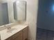 Bathroom with vanity, sink, and mirror at 11109 W Amelia Ave, Avondale, AZ 85392