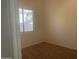 Bedroom with carpet flooring and a window at 11109 W Amelia Ave, Avondale, AZ 85392