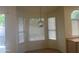 Bright breakfast nook with bay windows and modern hanging light fixture at 11109 W Amelia Ave, Avondale, AZ 85392