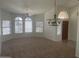 Inviting entryway showcasing a chandelier, arched window, and a wooden front door at 11109 W Amelia Ave, Avondale, AZ 85392