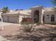 Inviting single-story home with a well-manicured yard, a tile roof, and a spacious three-car garage at 11109 W Amelia Ave, Avondale, AZ 85392