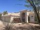Beautiful home featuring desert landscaping, a tile roof, a three-car garage, and an arched entrance at 11109 W Amelia Ave, Avondale, AZ 85392