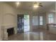 Open floor plan with a fireplace and access to the backyard at 11109 W Amelia Ave, Avondale, AZ 85392