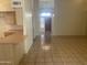 Open-concept space with tile flooring, high ceilings, and lots of natural light from the front door entryway at 11109 W Amelia Ave, Avondale, AZ 85392