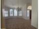Bright living room featuring a ceiling fan and large windows, creating an airy and inviting atmosphere at 11109 W Amelia Ave, Avondale, AZ 85392