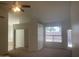 Spacious main bedroom with carpet flooring, and a sliding glass door to the backyard at 11109 W Amelia Ave, Avondale, AZ 85392
