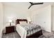 Cozy bedroom with a decorative quilt, ceiling fan, and closet space at 11312 E Newcastle Ave, Mesa, AZ 85209