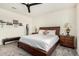 Bedroom features a dark wood bed, carpeted floors and ceiling fan at 11312 E Newcastle Ave, Mesa, AZ 85209