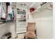Walk-in closet featuring built-in shelving and a chair at 11312 E Newcastle Ave, Mesa, AZ 85209