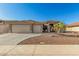 Charming single-story home featuring a well-manicured desert landscape, tile roof, and a spacious two-car garage at 11312 E Newcastle Ave, Mesa, AZ 85209