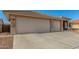 Spacious garage and driveway of a well-maintained house with neutral colors at 11312 E Newcastle Ave, Mesa, AZ 85209