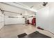 Spacious garage equipped with overhead lighting and a motorized door at 11312 E Newcastle Ave, Mesa, AZ 85209