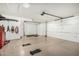 Spacious garage equipped with overhead lighting and a motorized door at 11312 E Newcastle Ave, Mesa, AZ 85209