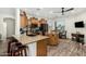 Spacious kitchen features wood cabinets, granite counters, and modern black appliances at 11312 E Newcastle Ave, Mesa, AZ 85209
