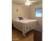A comfortable bedroom with great natural lighting and a ceiling fan at 11653 N Hacienda Dr, Sun City, AZ 85351