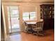 Dining area with sliding doors to the backyard and a classic wood china cabinet for storage at 11653 N Hacienda Dr, Sun City, AZ 85351