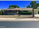 Charming single-story home with well-maintained landscaping, desert rock and mature desert plants at 11653 N Hacienda Dr, Sun City, AZ 85351