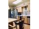 Functional kitchen with wood cabinets, stainless steel appliances, and adjacent dining area at 11653 N Hacienda Dr, Sun City, AZ 85351