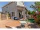 Backyard featuring a table, chairs, and an outdoor swingset on artificial turf at 1232 S 120Th Ln, Avondale, AZ 85323