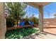 Outdoor swing set in a backyard covered in decorative flora at 1232 S 120Th Ln, Avondale, AZ 85323
