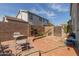 Backyard with a grill, furniture, brick features, and a closed gate at 1232 S 120Th Ln, Avondale, AZ 85323