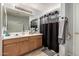 Bathroom offers vanity space, a large mirror, and a shower with tasteful fixtures and natural light at 1232 S 120Th Ln, Avondale, AZ 85323