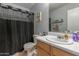 Bathroom with a shower, toilet, sink, and a white cabinet at 1232 S 120Th Ln, Avondale, AZ 85323