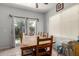 Cozy dining room featuring a wooden table set and natural light from the sliding glass doors at 1232 S 120Th Ln, Avondale, AZ 85323