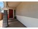 Welcoming front porch featuring a stylish entry door, decorative accents, and neutral tones, offering curb appeal at 1232 S 120Th Ln, Avondale, AZ 85323