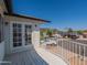 Outside view from a balcony with white railings overlooking the neighborhood with parking at 13438 N 18Th Ln, Phoenix, AZ 85029