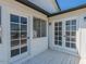 View of a bright balcony with access to the outside through white framed glass doors and a window at 13438 N 18Th Ln, Phoenix, AZ 85029