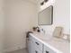 Updated bathroom with gray cabinets, white countertops, and modern fixtures at 13438 N 18Th Ln, Phoenix, AZ 85029