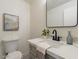 Bathroom features a modern vanity with marble countertop and black faucet at 13438 N 18Th Ln, Phoenix, AZ 85029