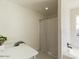 Bright bathroom with white countertops, stylish faucet, tub and shower at 13438 N 18Th Ln, Phoenix, AZ 85029