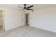 A spacious bedroom with neutral carpet and ceiling fan at 13438 N 18Th Ln, Phoenix, AZ 85029