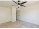 A spacious bedroom with neutral carpet and ceiling fan at 13438 N 18Th Ln, Phoenix, AZ 85029