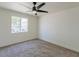 Bedroom features neutral carpet and a window at 13438 N 18Th Ln, Phoenix, AZ 85029