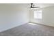 A spacious bedroom with neutral carpet and a window at 13438 N 18Th Ln, Phoenix, AZ 85029